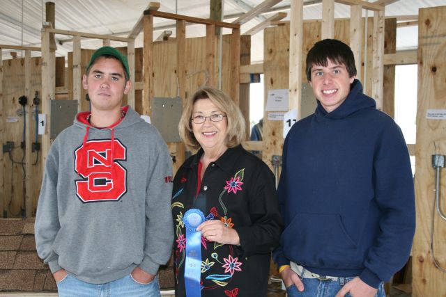 Two students from Caldwell Career Center Middle College in Hudson won the 26th Annual Carpentry Contest at the N.C. State Fair. Left to right: Bosie Kirby of Hudson, Labor Commissioner Cherie Berry, and Raymond Croon of Lenoir. 